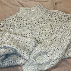 Knit sweater. Light blue color.